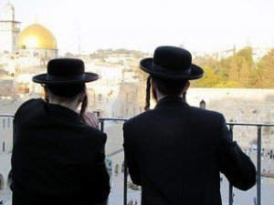 Two chareidi young men looking at the Kotel