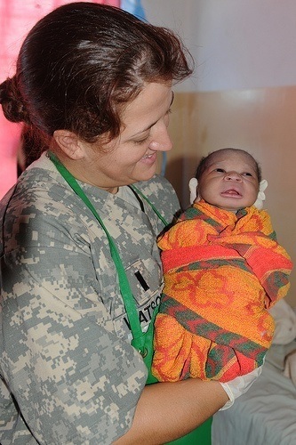 Army nurse with new born